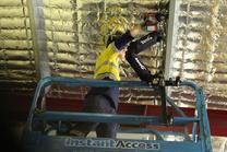 Overhead Drilling with ZeroG tool holder arm Ekso tool support pneumatic chipping overhead construction work chipping from man lift manliift chipping demolition ergonomics